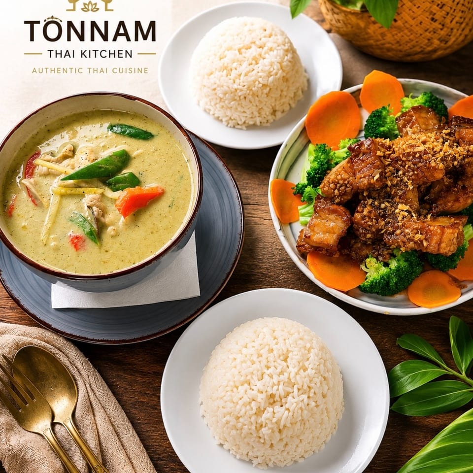 A spread of Thai dishes: green curry, crispy pork belly with broccoli and carrots, and two servings of rice.