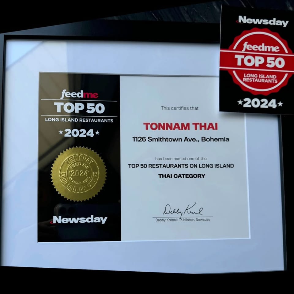 Framed certificate and card recognizing Tonnnam Thai as a Feed Me Top 50 Long Island Restaurant 2024.